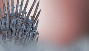 Metal knight swords thrones background.