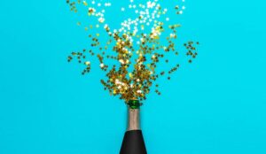 A photo of a champagne bottle with gold stars