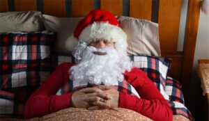 A picture of Santa asleep in bed