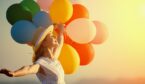 A happy person with balloons