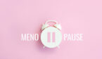 Word Menopause, pause sign on a white alarm clock on pink background