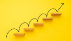 Rising arrow on staircase on yellow background - improvement concept