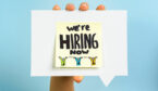 A note saying we are hiring how on a speech bubble being held