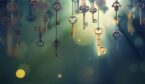 A conceptual image with hanging keys and one shining key.