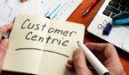 Customer Centric strategy concept with the words written on notepad