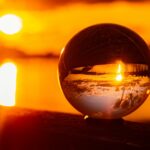 sunset in the background with a crystal sphere