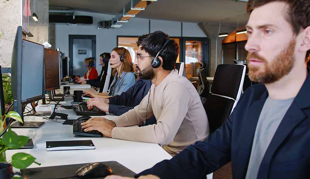 Call centre workers working at desks