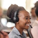 Happy contact centre agents in headsets