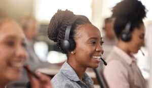 Happy contact centre agents in headsets