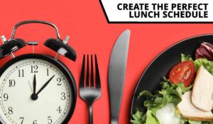 Plate of food, cutlery, alarm clock - lunch schedule concept