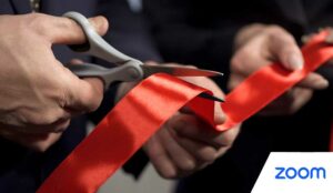 Business people hands cutting red ribbon - opening ceremony
