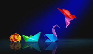 Transform and success concept with a crumpled paper transforming into a boat then a swan and a flying bird.