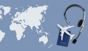 Headset, passport and mini plane on a map