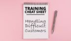 A notebook and pen - training cheat sheet for handling difficult customers