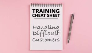 A notebook and pen - training cheat sheet for handling difficult customers