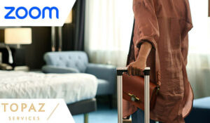 Person with suitcase entering a hotel room