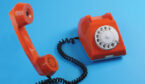 Picture of retro telephone over blue background