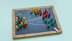 Board with arrows and colored figures.