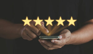 Person on phone with 5 stars