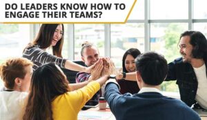 An engaged team high fiving in an office