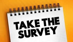 take the survey written in black on an orange background