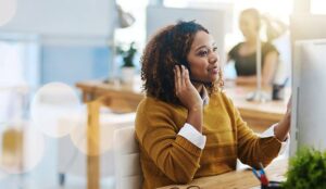 A contact centre worker on the phone to a customer