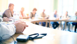 People at meeting table discussing strategy