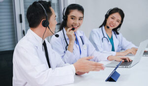 Healthcare workers with call centre headsets on