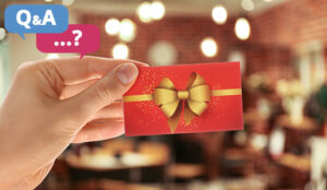 Woman holding gift card